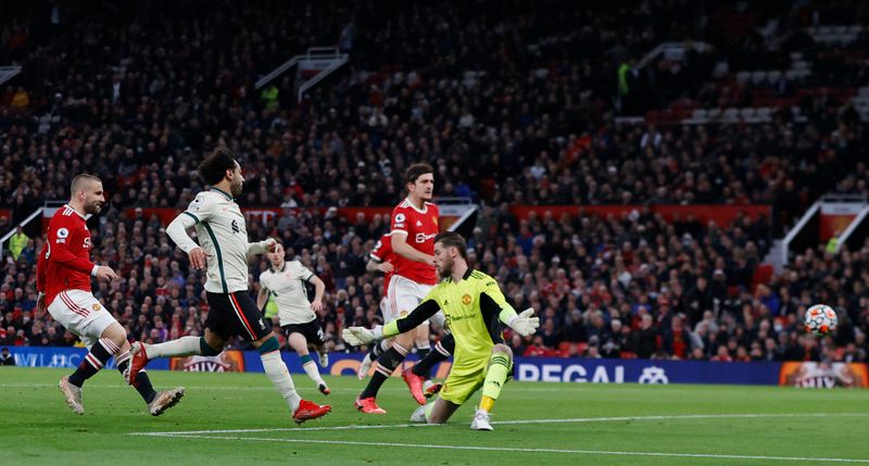 © Reuters. Soccer Football - Premier League - Manchester United v Liverpool - Old Trafford, Manchester, Britain - October 24, 2021 Liverpool's Mohamed Salah scores their fifth goal and his hat-trick REUTERS/Phil Noble 