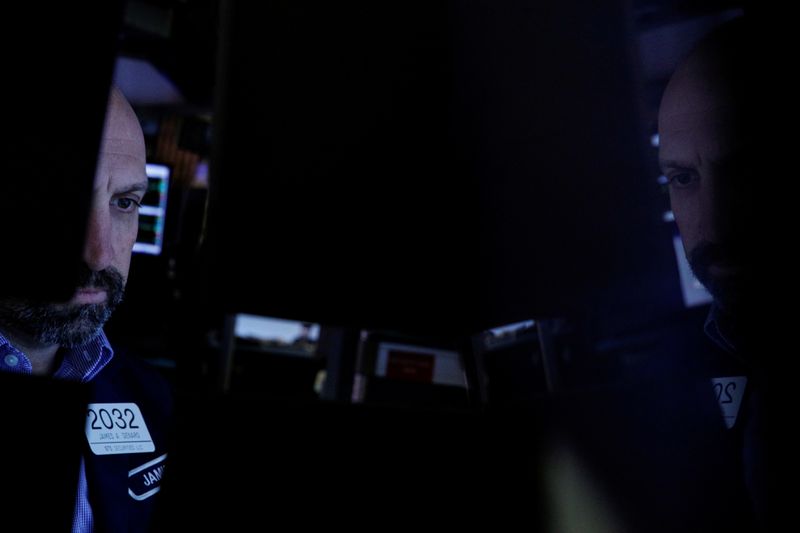 &copy; Reuters. FILE PHOTO: A Specialist trader works inside a booth on the floor of the New York Stock Exchange (NYSE) in New York City, U.S., October 20, 2021.  REUTERS/Brendan McDermid