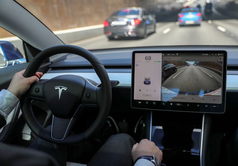 &copy; Reuters. FILE PHOTO: The interior of a Tesla Model 3 electric vehicle is shown in this picture illustration taken in Moscow, Russia July 23, 2020. Picture taken July 23, 2020. REUTERS/Evgenia Novozhenina/File Photo