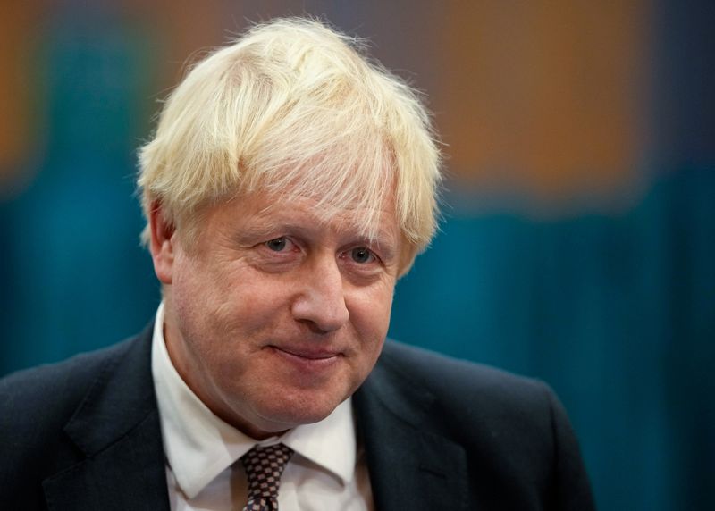 &copy; Reuters. Britain's Prime Minister Boris Johnson speaks to the media as he visits at a COVID-19 vaccination centre at Little Venice Sports Centre, in London, Britain October 22, 2021.  Matt Dunham/Pool via REUTERS