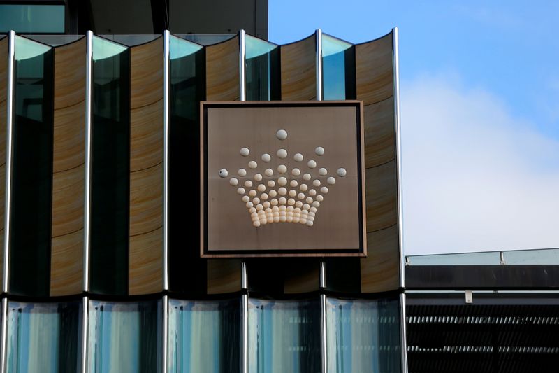 &copy; Reuters. FILE PHOTO: The logo of Australian casino giant Crown Resorts Ltd adorns the hotel and casino complex in Melbourne, Australia, June 13, 2017.  REUTERS/Jason Reed