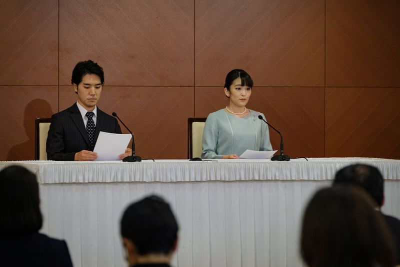 &copy; Reuters. Japan's Princess Mako and her husband Kei Komuro deliver a speech during a news conference to announce their wedding at Grand Arc Hotel in Tokyo, Japan, October 26, 2021. Nicolas Datiche/Pool via REUTERS