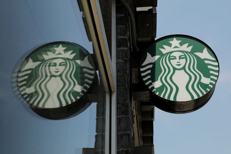 &copy; Reuters. A Starbucks logo hangs outside of one of the 8,000 Starbucks-owned American stores that will close around 2 p.m. local time on Tuesday as a first step in training 175,000 employees on racial tolerance in the Brooklyn borough of New York, U.S., May 29, 201