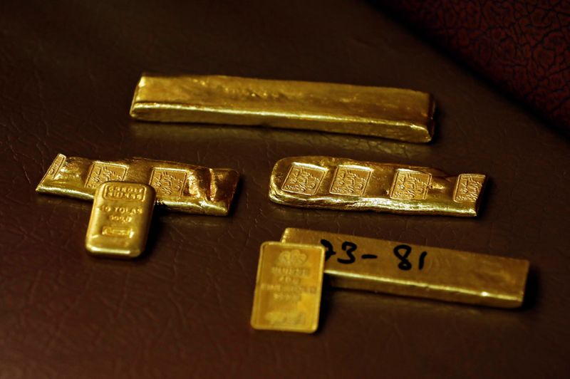 &copy; Reuters. Gold ingots, inscribed with details, are displayed at a wholesale gold shop, as the coronavirus disease (COVID-19) outbreak continues, in Peshawar, Pakistan August 6, 2020. REUTERS/Fayaz Aziz