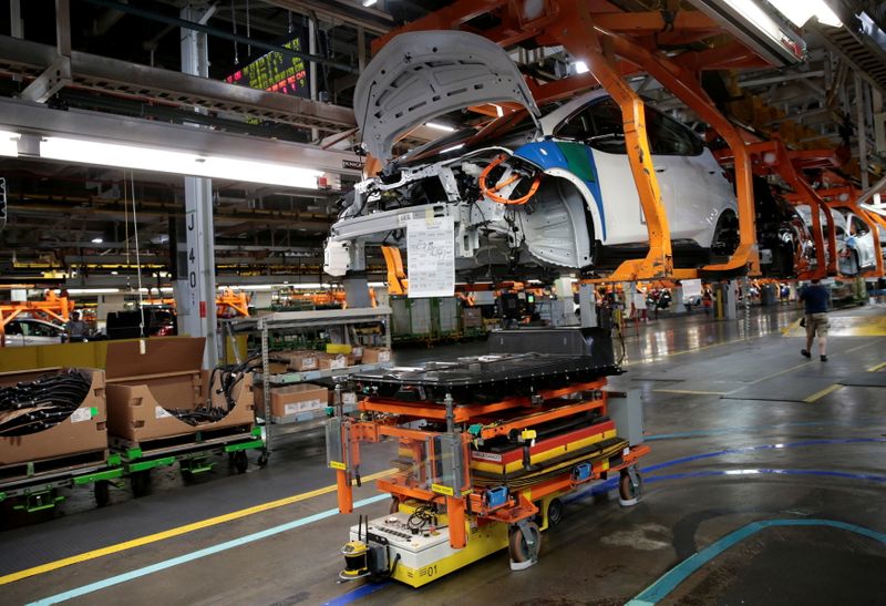 &copy; Reuters. FILE PHOTO: An automated guided vehicle carrying a battery pack moves under a partially assembled 2018 Chevrolet Bolt EV vehicle on the assembly line at General Motors Orion Assembly in Lake Orion, Michigan, U.S., March 19, 2018.  Photo taken March 19, 20