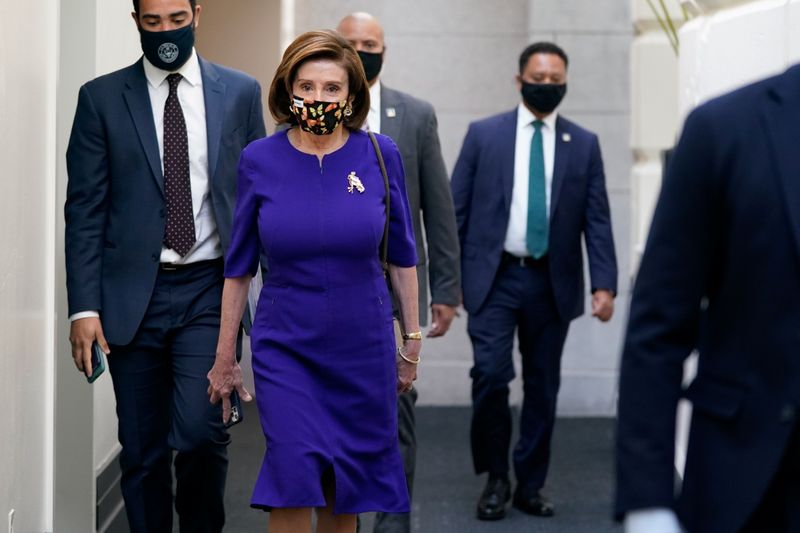 &copy; Reuters. House Speaker Nancy Pelosi (D-CA) arrives to a Democratic Caucus meeting on Capitol Hill in Washington, U.S., October 26, 2021. REUTERS/Elizabeth Frantz