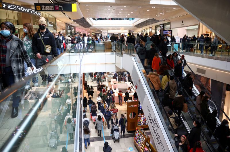 &copy; Reuters. FILE PHOTO: People walk through the Westfield Stratford City shopping centre, amid the coronavirus disease (COVID-19) outbreak in London, Britain, December 5, 2020. REUTERS/Henry Nicholls//File Photo