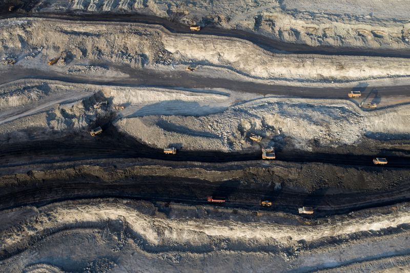 &copy; Reuters. FILE PHOTO: An aerial view shows machinery working in an open-pit coal mine in Ejin Horo Banner, Ordos, Inner Mongolia Autonomous Region, China, October 19, 2021. Picture taken with a drone. China Daily via REUTERS  