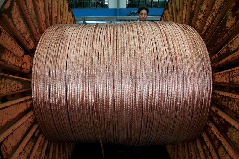 &copy; Reuters. FILE PHOTO: An employee works at an electricity cable factory in Baoying, Jiangsu province, China, July 23, 2006. REUTERS/Aly Song