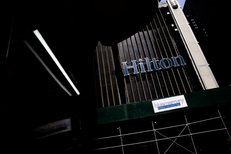 &copy; Reuters. FILE PHOTO: Hilton hotel logo is seen on 52nd street following the outbreak of coronavirus disease (COVID-19), in New York City, U.S., March 18, 2020. REUTERS/Jeenah Moon