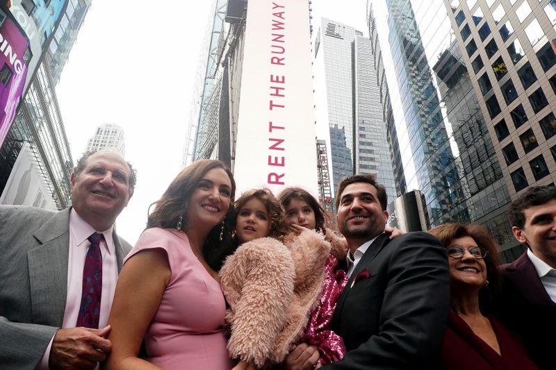 &copy; Reuters. CEO of Rent the Runway Jennifer Hyman, husband Benjamin Stauffer and their children Aurora and Selene pose for photos after their IPO on the NASDAQ exchange in Times Square in the Manhattan borough of New York City, New York, U.S., October 27, 2021.  REUT
