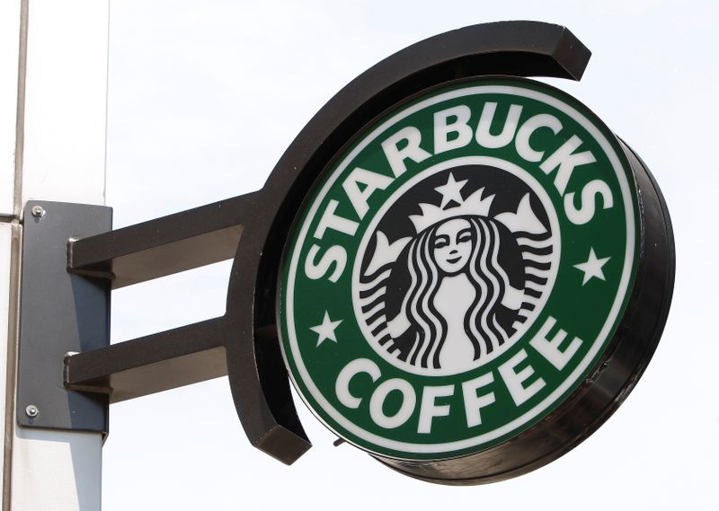&copy; Reuters. FILE PHOTO: The Starbucks sign is seen outside one of its stores in New York July 3, 2008. REUTERS/Chip East