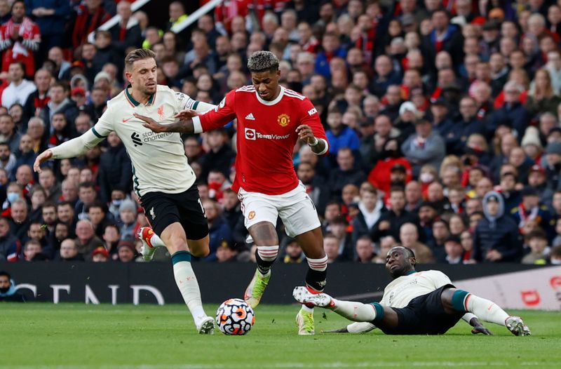 &copy; Reuters. FILE PHOTO: Soccer Football - Premier League - Manchester United v Liverpool - Old Trafford, Manchester, Britain - October 24, 2021 Manchester United's Marcus Rashford in action with Liverpool's Jordan Henderson and Naby Keita REUTERS/Phil Noble 