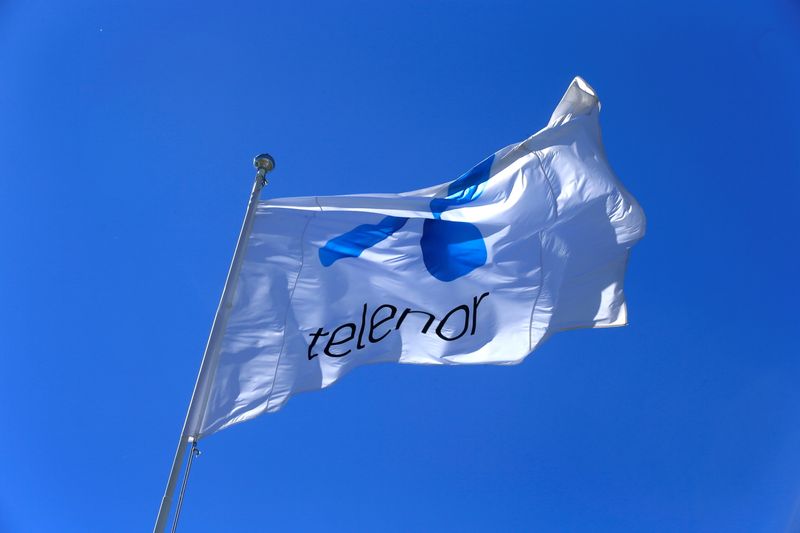 &copy; Reuters. FILE PHOTO: Telenor flag flutters next to the company's headquarters in Fornebu, Norway, June 1, 2017. REUTERS/Ints Kalnins