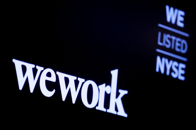 &copy; Reuters. FILE PHOTO: The WeWork logo is displayed on a screen during the company's IPO on the floor of the New York Stock Exchange (NYSE) in New York City, U.S., October 21, 2021.  REUTERS/Brendan McDermid