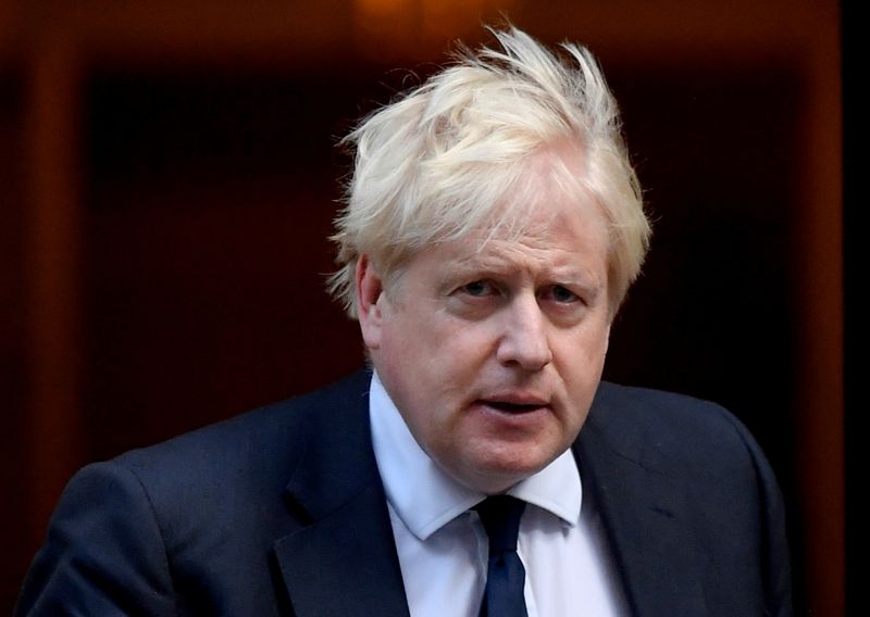 &copy; Reuters. FILE PHOTO: Britain's Prime Minister Boris Johnson walks outside Downing Street in London, Britain October 20, 2021. REUTERS/Toby Melville/File Photo