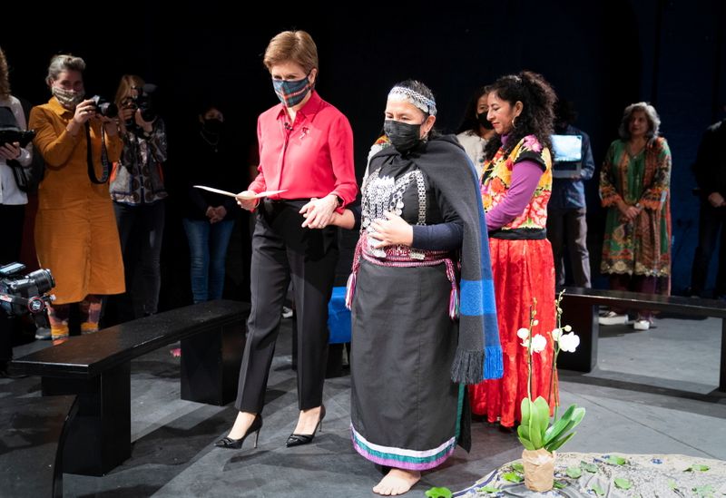 &copy; Reuters. Scotland's First Minister Nicola Sturgeon attends a ceremonial gathering with Mapuche elder Panchita Calfin and Minga Indigena indigenous delegates ahead of the 2021 United Nations Climate Change Conference (COP26), in Glasgow, Britain October 30, 2021. J