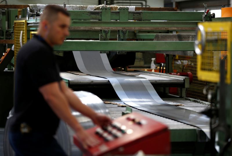 &copy; Reuters. FILE PHOTO: A worker at perforating company Bion uses a machine at the factory in Reading, Britain September 22, 2016. REUTERS/Peter Nicholls