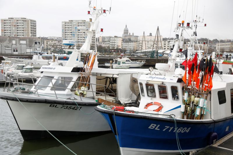 &copy; Reuters. FILE PHOTO: Fishing trawlers are docked at Boulogne-sur-Mer after Britain and the European Union brokered a last-minute post-Brexit trade deal, northern France, December 28, 2020. REUTERS/Charles Platiau/File Photo