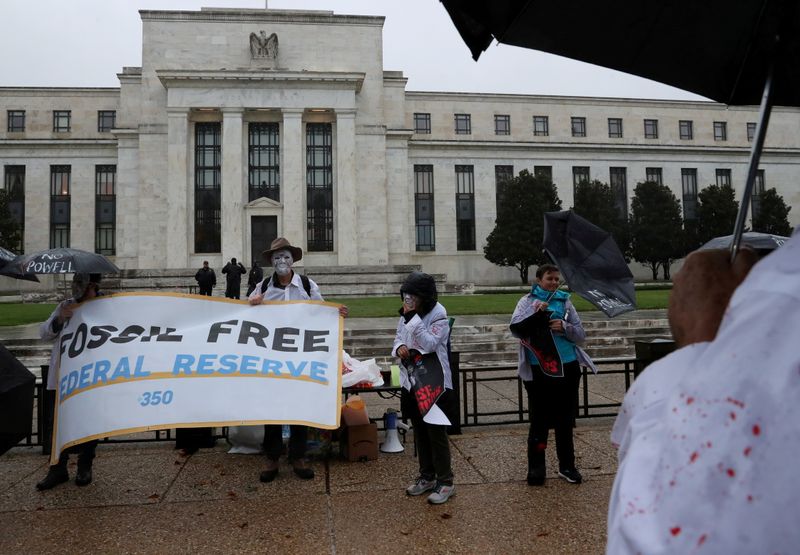 &copy; Reuters. FILE PHOTO: Climate change activists voice their opposition to U.S. President Joe Biden reappointing Jerome Powell to serve a second four-year term as the chairman of the Federal Reserve and demand Biden appoint a climate advocate, during a rally outside 