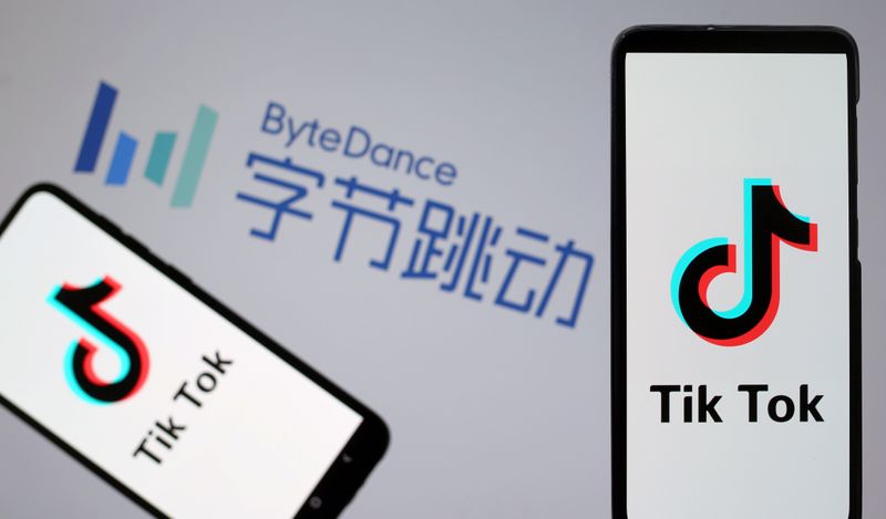 &copy; Reuters. Tik Tok logos are seen on smartphones in front of a displayed ByteDance logo in this illustration taken November 27, 2019. REUTERS/Dado Ruvic/Illustration