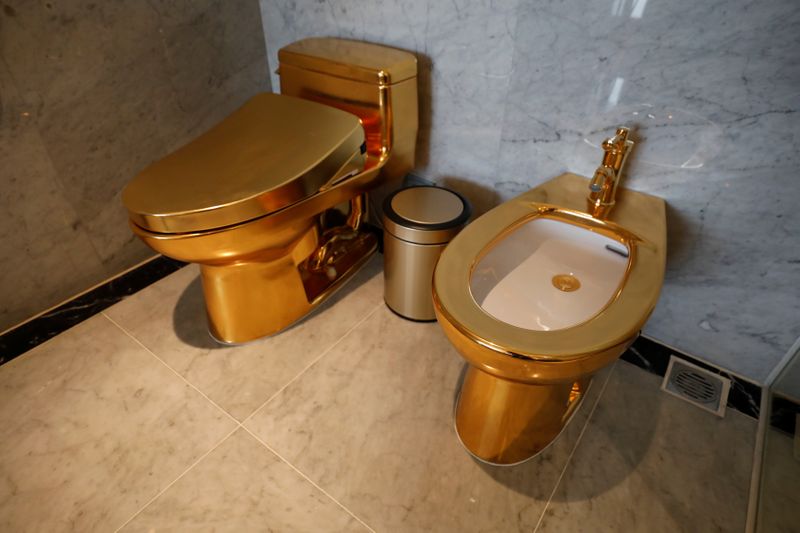 &copy; Reuters. Gold plated toilets are seen at the newly-inaugurated Dolce Hanoi Golden Lake hotel, after the government eased a nationwide lockdown following the global outbreak of the coronavirus disease (COVID-19), in Hanoi, Vietnam July 2, 2020. REUTERS/Kham