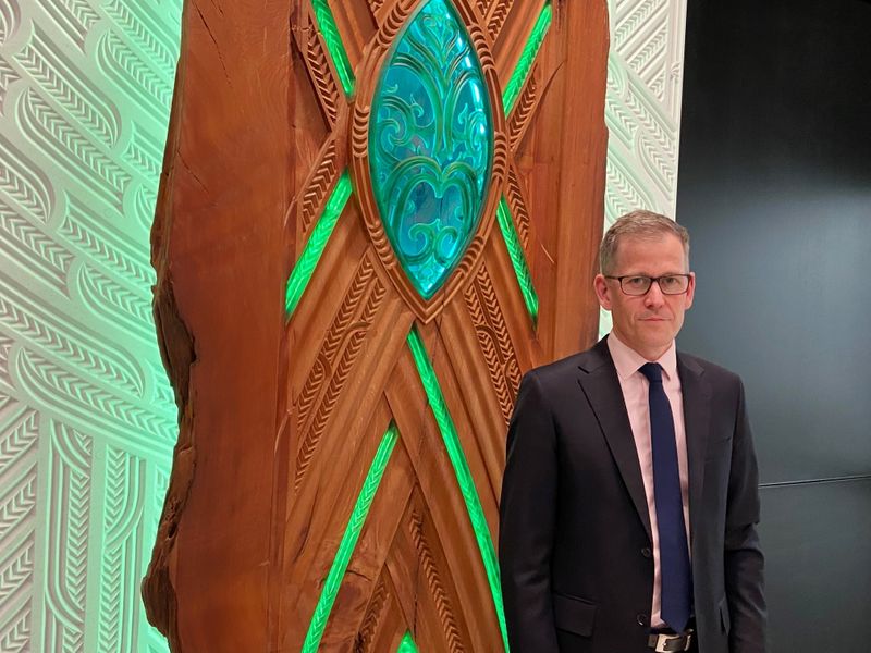 &copy; Reuters. Assistant Governor Christian Hawkesby stands with an art installation of Maori forest god Tane Mahuta at the lobby of New Zealand's Central Bank building in Wellington, New Zealand September 22, 2021. REUTERS/Praveen Menon