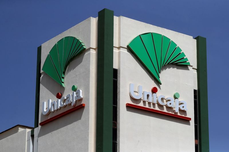 © Reuters. FILE PHOTO: The logo of Unicaja bank is seen on the facade of the Data Processing Center of Unicaja bank in Ronda, southern Spain, September 7, 2021. REUTERS/Jon Nazca