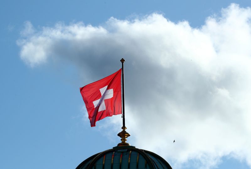 &copy; Reuters. FILE PHOTO: A flag flutters on the Swiss Parliament Building (Bundeshaus), after the weekly governmental meeting in Bern, Switzerland, November 27, 2019.  REUTERS/Denis Balibouse