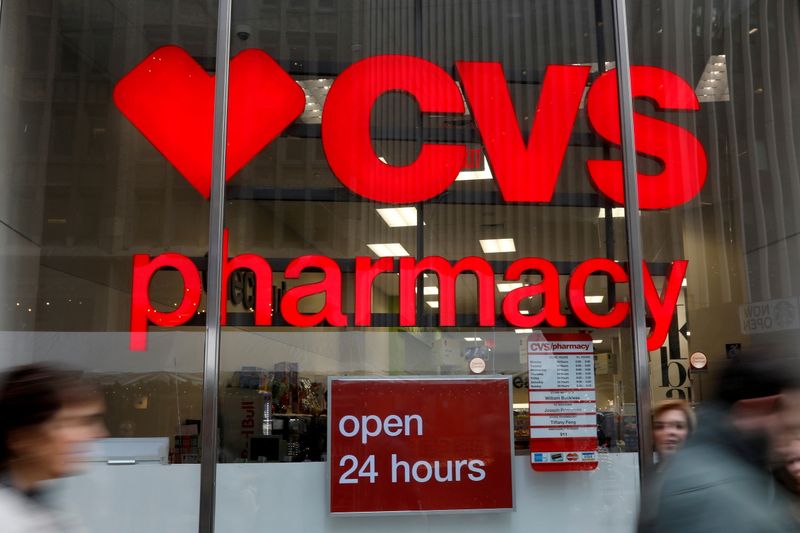 &copy; Reuters. FILE PHOTO: People walk by a CVS Pharmacy store in the Manhattan borough of New York City, New York, U.S., November 30, 2017. REUTERS/Shannon Stapleton/File Photo