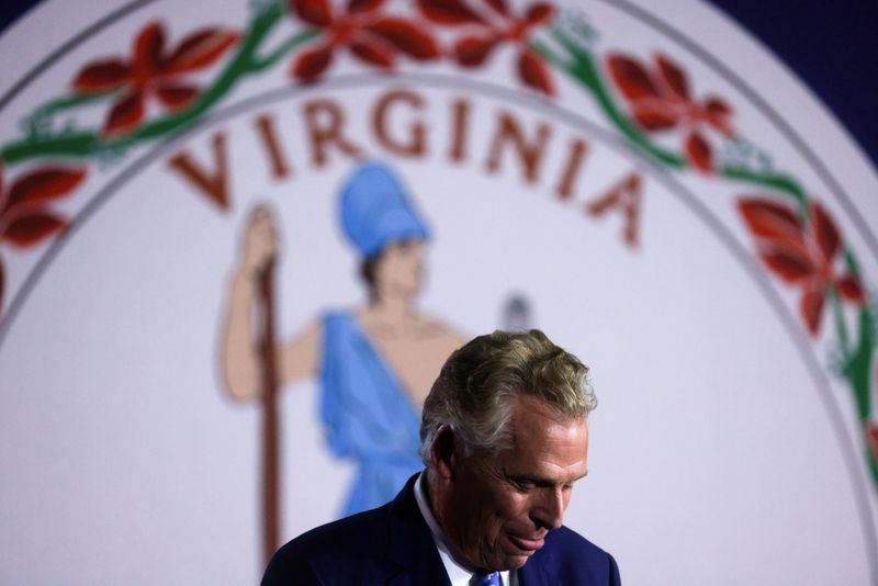 © Reuters. Democratic nominee for Virginia Governor Terry McAuliffe looks on as he addresses supporters during an election night party and rally in McLean, Virginia, U.S., November 2, 2021. REUTERS/Leah Millis   