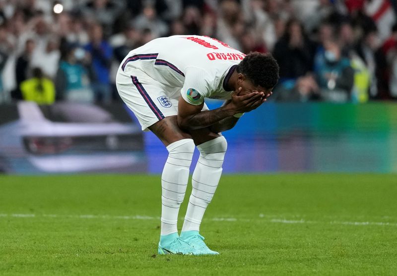 &copy; Reuters. FILE PHOTO: Soccer Football - Euro 2020 - Final - Italy v England - Wembley Stadium, London, Britain - July 11, 2021 England's Marcus Rashford looks dejected after missing a penalty during a penalty shootout Pool via REUTERS/Frank Augstein/File Photo