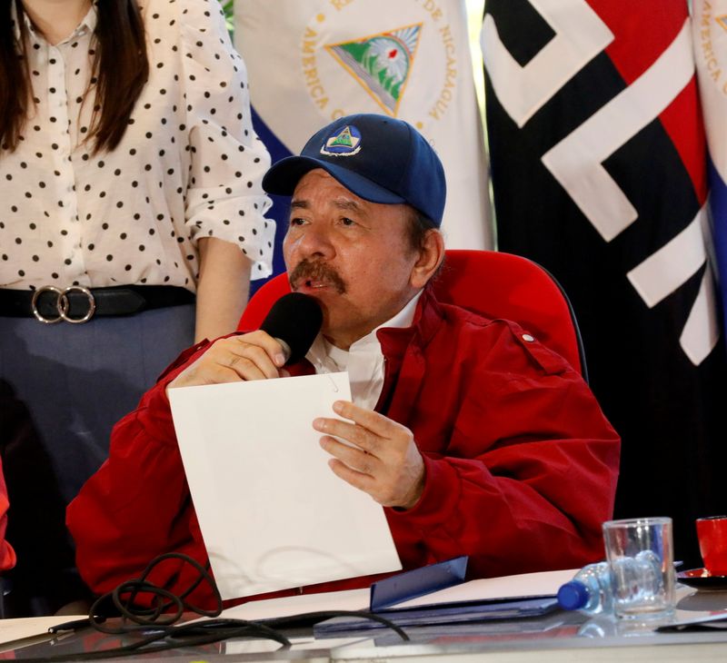 &copy; Reuters. FILE PHOTO: Nicaraguan President Daniel Ortega holds a document while speaking during an event with Honduras President Juan Orlando Hernandez (not pictured) where they signed a territorial treaty to define their borders in the Caribbean Sea and the Pacifi