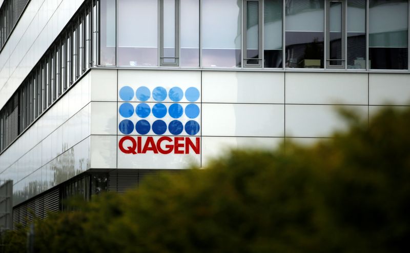 &copy; Reuters. A logo of a testing company Qiagen is seen as Economy Minister Andreas Pinkwart and Health Minister Karl-Josef Laumann of the German state Northrhine Westphalia visit Qiagen's facility, in Hilden, Germany, September 8, 2020. REUTERS/Leon Kuegeler