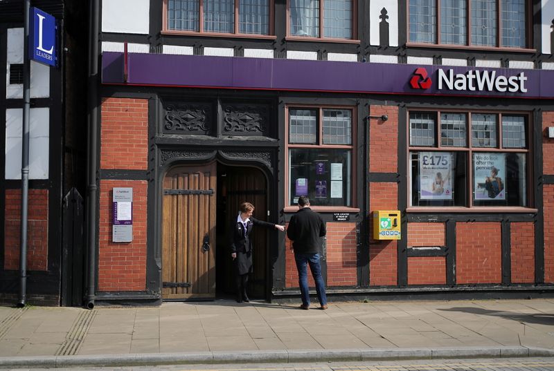 &copy; Reuters. FILE PHOTO: People outside a Natwest bank in Northwich as the spread of the coronavirus disease (COVID-19) continues, Britain, March 24, 2020. REUTERS/Molly Darlington/File Photo
