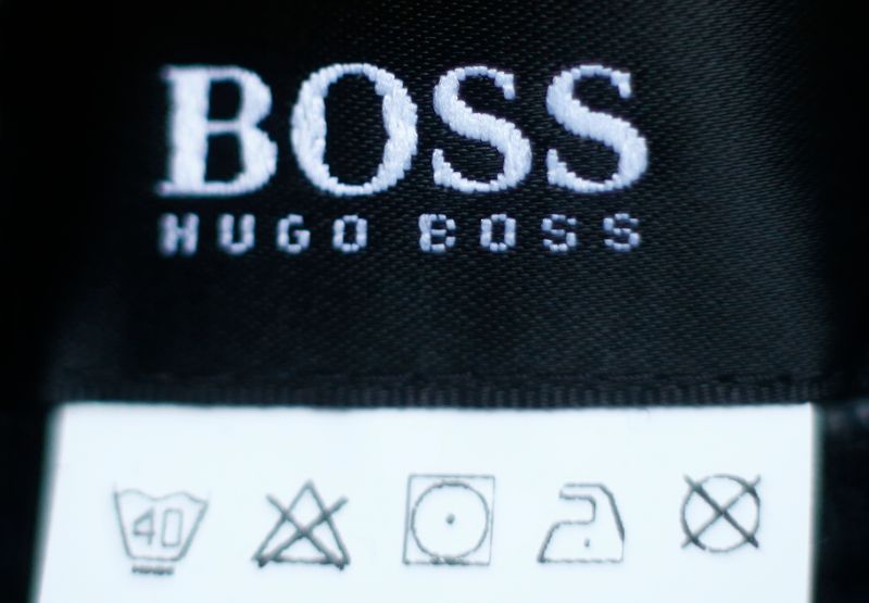 &copy; Reuters. FILE PHOTO: The logo of German fashion house Hugo Boss is seen on a clothing label at their outlet store in Mezingen near Stuttgart October 29, 2013. REUTERS/Michael Dalder 