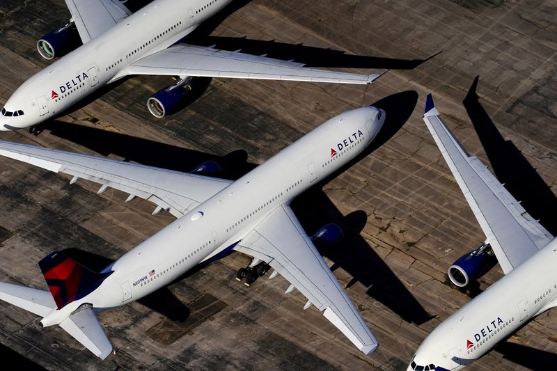 &copy; Reuters. FILE PHOTO: Delta Air Lines passenger planes are seen parked due to flight reductions made to slow the spread of COVID-19, at Birmingham-Shuttlesworth International Airport in Birmingham, Alabama, U.S. March 25, 2020.  REUTERS/Elijah Nouvelage/File Photo