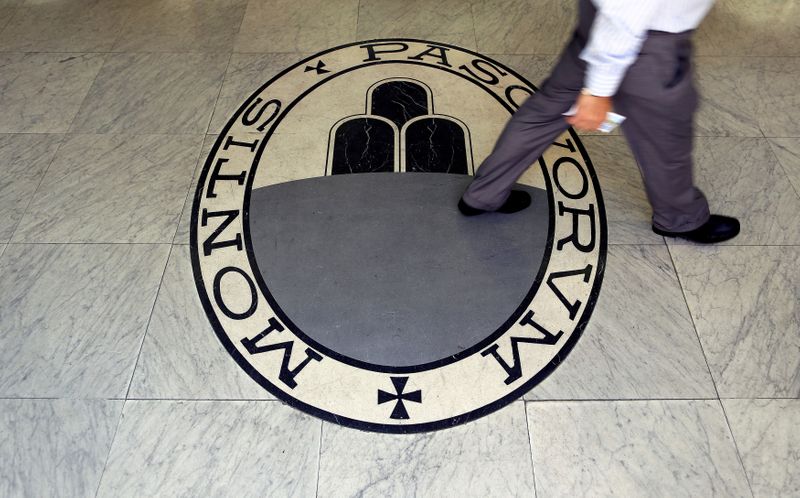 &copy; Reuters. FILE PHOTO: A man walks across the logo of the Monte dei Paschi di Siena bank in Rome, Italy, September 24, 2013. REUTERS/Alessandro Bianchi
