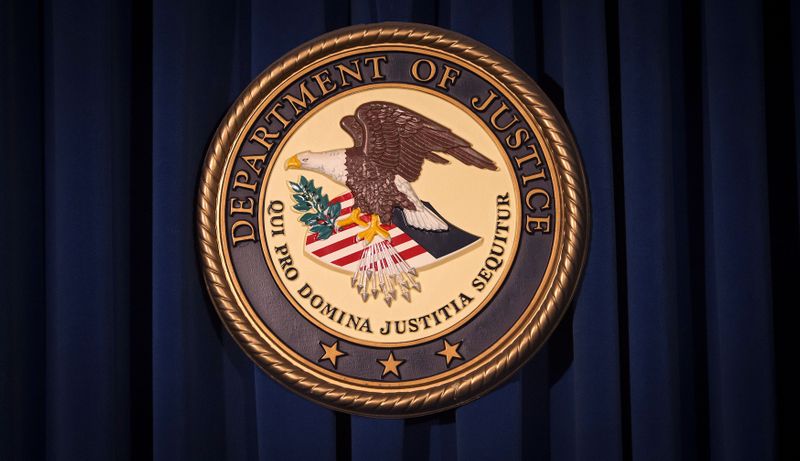&copy; Reuters. FILE PHOTO: The Department of Justice (DOJ) logo is pictured on a wall after a news conference in New York December 5, 2013./File Photo