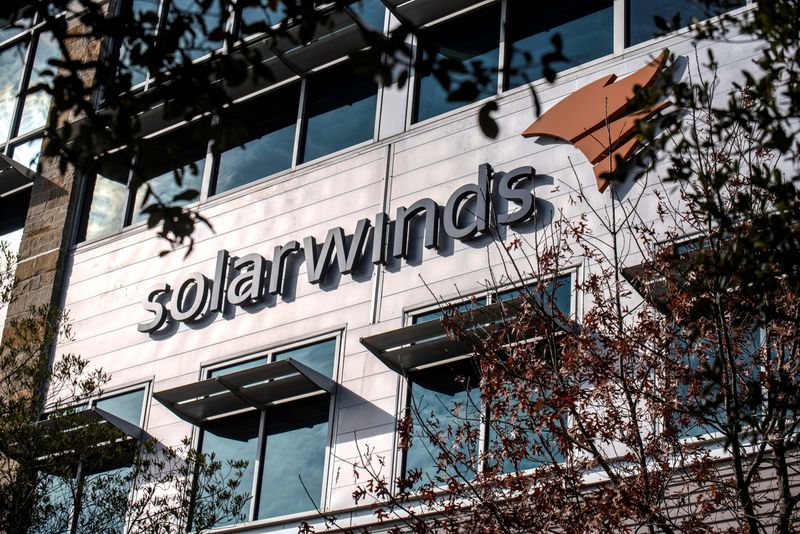 &copy; Reuters. FILE PHOTO: The SolarWinds logo is seen outside its headquarters in Austin, Texas, U.S., December 18, 2020. REUTERS/Sergio Flores/File Photo