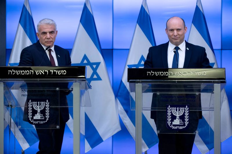 &copy; Reuters. Israeli Prime Minister Naftali Bennett reacts during a news conference with Foreign Minister Yair Lapid and Finance Minister Avigdor Liberman (unseen) at the Government Press Office, (GPO) in Jerusalem November 6, 2021. Ohad Zwigenberg/Pool via REUTERS
