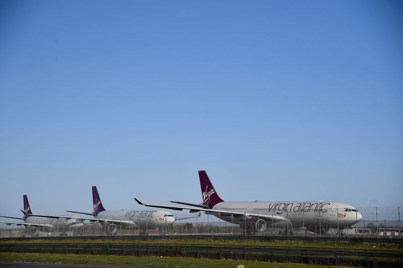 &copy; Reuters. FILE PHOTO: Virgin Atlantic planes are seen at Heathrow airport as the spread of the coronavirus disease (COVID-19) continues, London, Britain, March 31, 2020. REUTERS/Toby Melville/File Photo