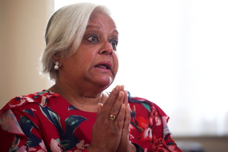 &copy; Reuters. FILE PHOTO: Bhavna Patel, who is due to fly to New York with her daughter Bindiya Patel to reunite with family following the relaxing of the coronavirus disease (COVID-19) travel restrictions, speaks during an interview with Reuters at their home in Croyd