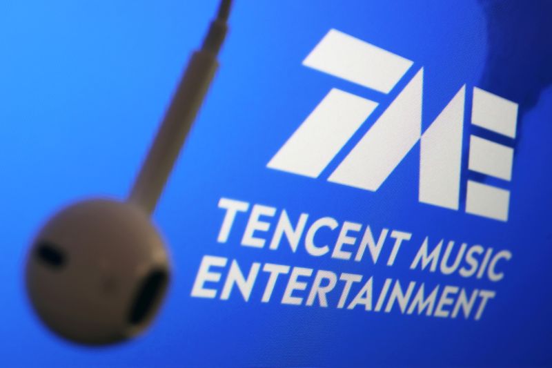 &copy; Reuters. FILE PHOTO: The logo of China's Tencent Music Entertainment Group is seen next to an earphone in this illustration picture taken March 22, 2021. REUTERS/Florence Lo/Illustration/File Photo  GLOBAL BUSINESS WEEK AHEAD