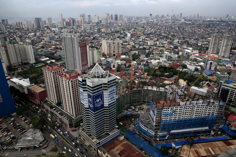 &copy; Reuters. FILE PHOTO: Construction of new buildings alongside older establishments is seen within the business district in Makati City, metro Manila, Philippines January 25, 2017. REUTERS/Romeo Ranoco