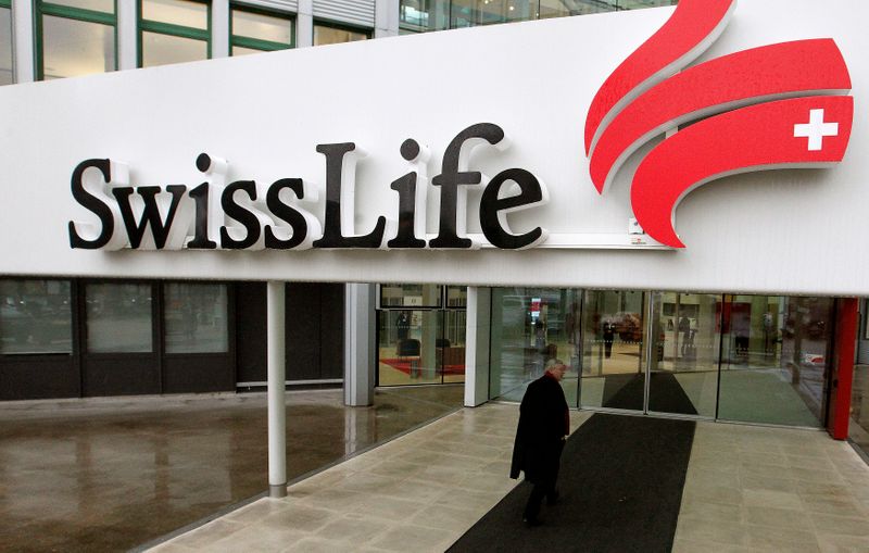 &copy; Reuters. FILE PHOTO: A man walks in front of the entrance of an office of Swiss Life, Switzerland's biggest dedicated life insurer in Zurich November 28, 2012. REUTERS/Arnd Wiegmann