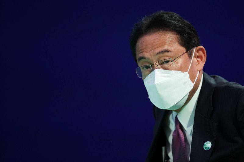 &copy; Reuters. FILE PHOTO: Fumio Kishida, Prime Minister of Japan, waits before speaking during the UN Climate Change Conference (COP26) in Glasgow, Scotland, Britain, November 2, 2021. REUTERS/Hannah McKay/Pool