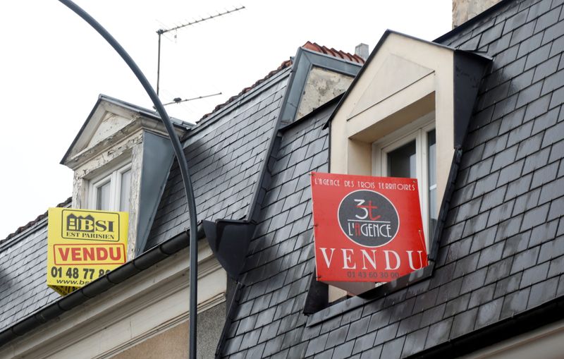 &copy; Reuters. FILE PHOTO: Real estate agent's boards reading 'Sold' are seen on residential buildings at Fontenay-sous-Bois near Paris, France, December 11, 2020. REUTERS/Charles Platiau/File Photo