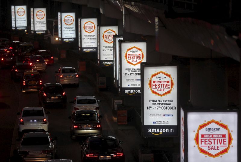 &copy; Reuters. FILE PHOTO: Traffic moves on a road past advertisements of Indian online marketplace Amazon, in Mumbai, India, October 15, 2015.   REUTERS/Shailesh Andrade