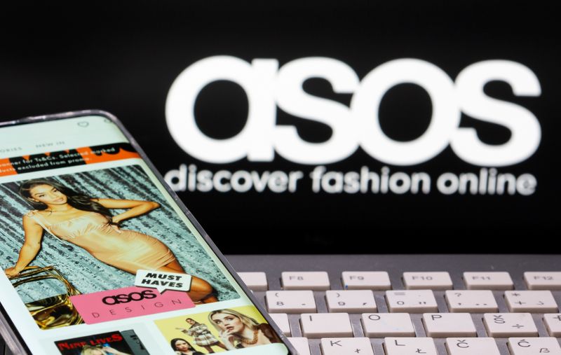 &copy; Reuters. FILE PHOTO: Smartphone with an ASOS app and a keyboard are seen in front of a displayed ASOS logo in this illustration picture taken October 13, 2020. REUTERS/Dado Ruvic/Illustration